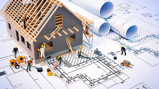 building house on blueprints with worker - construction project Inklusion in der Jugendarbeit